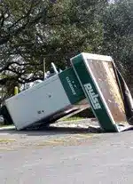 Damaged ATM kiosk toppled over from hurricane flood